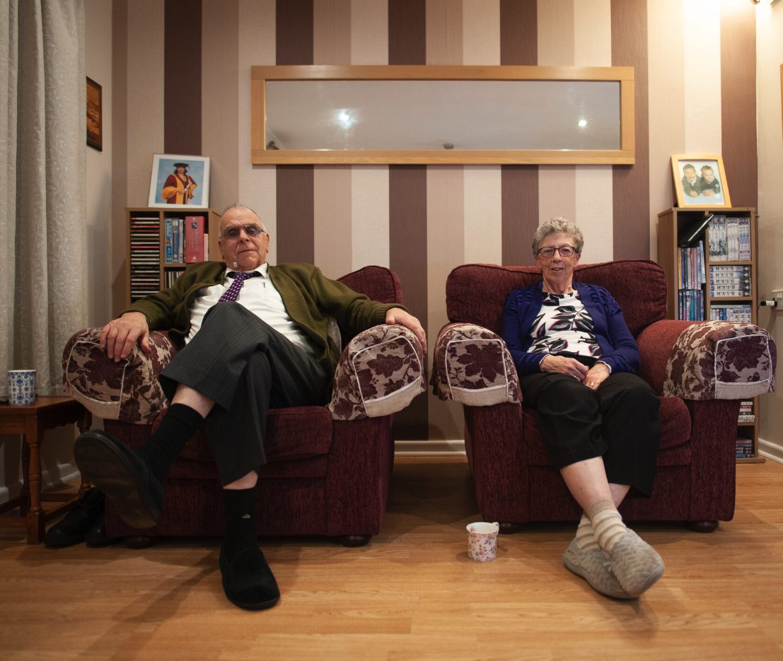 Older couple sat in room