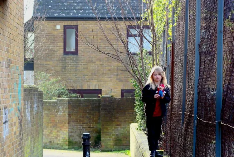 Girl Walking in Alleyway